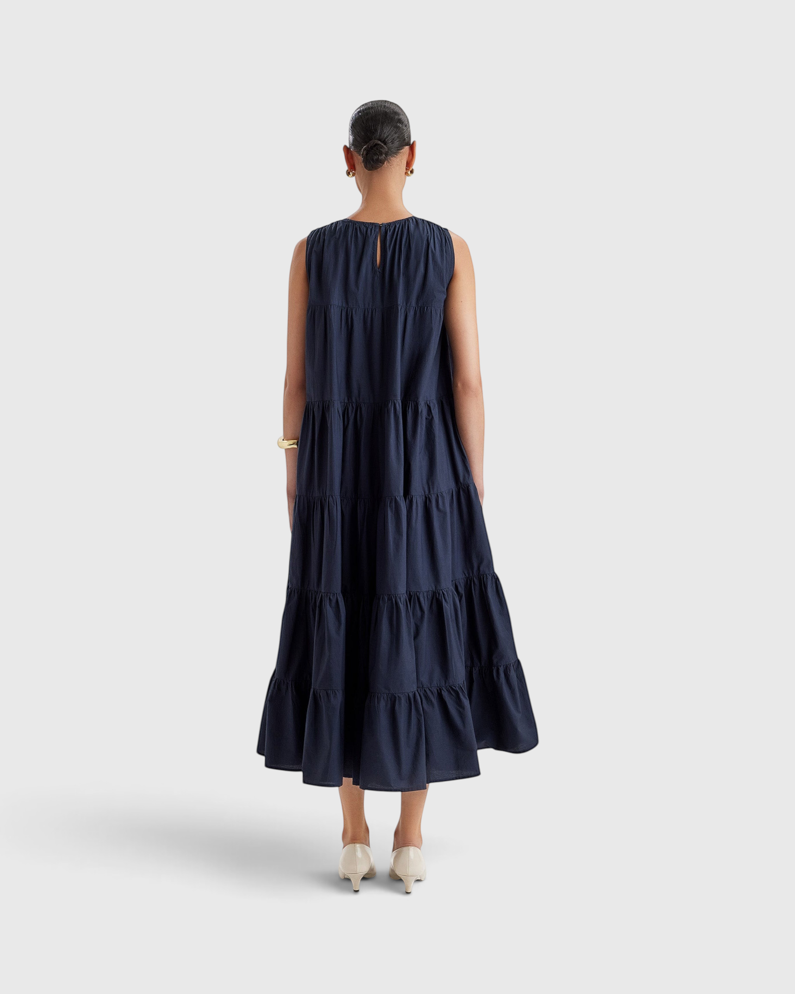 Merlette Caron Dress in Navy - back view showing the keyhole closure and gathered tiers
