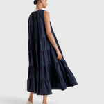 Merlette Caron Dress in Navy - three-quarter view showing the tiered skirt in movement