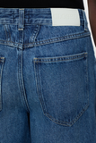 Back pocket close up of Lyna Jeans - Dark Blue