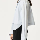 SECULAR Collins Shirt in Blue Stripe, side detail of layered front panel and curved shirttail