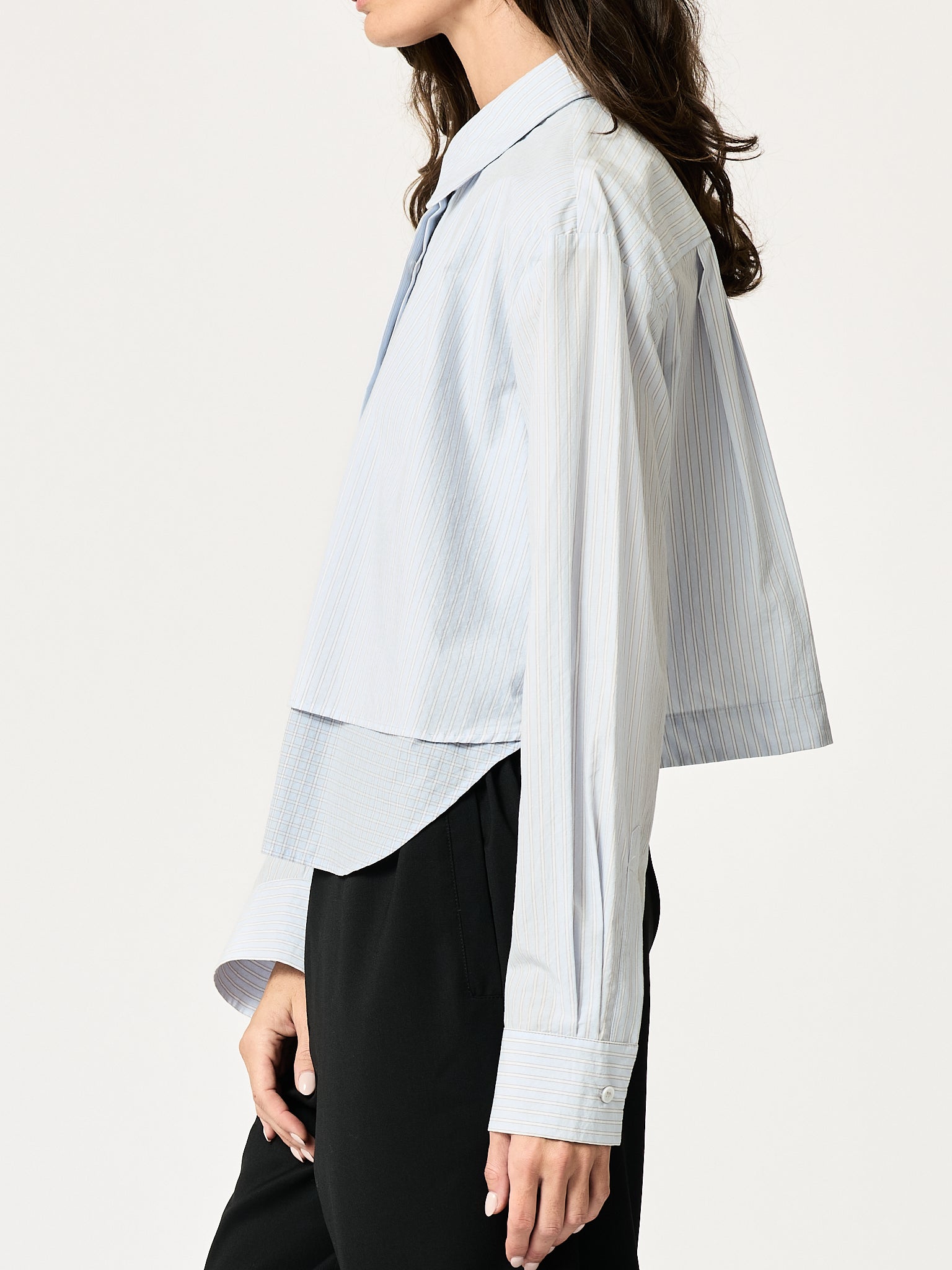 SECULAR Collins Shirt in Blue Stripe, side detail of layered front panel and curved shirttail
