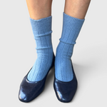 JONES + CO Le Bon Shoppe Classic Cashmere Socks in Bluebell blue, worn on a model.