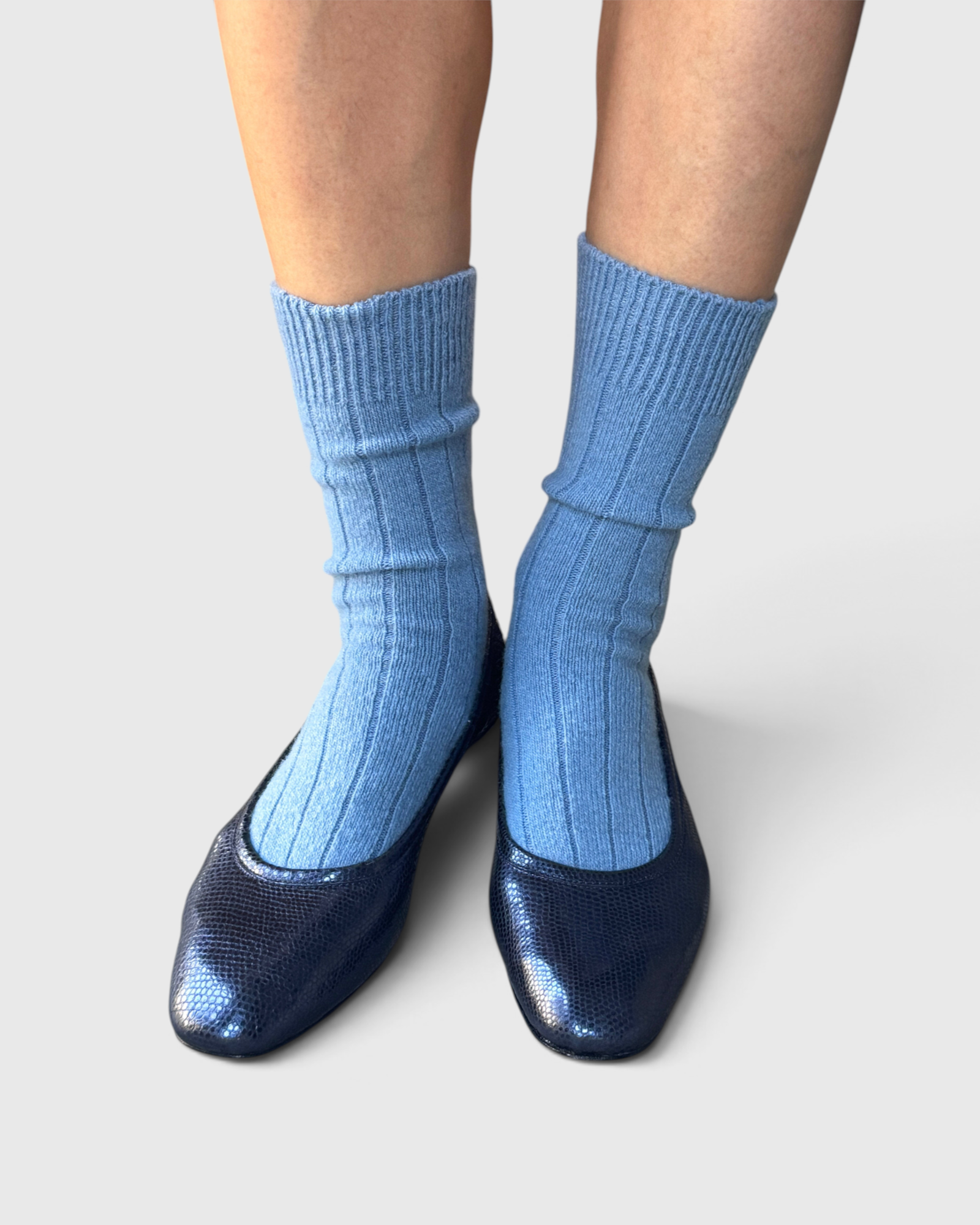 JONES + CO Le Bon Shoppe Classic Cashmere Socks in Bluebell blue, worn on a model.