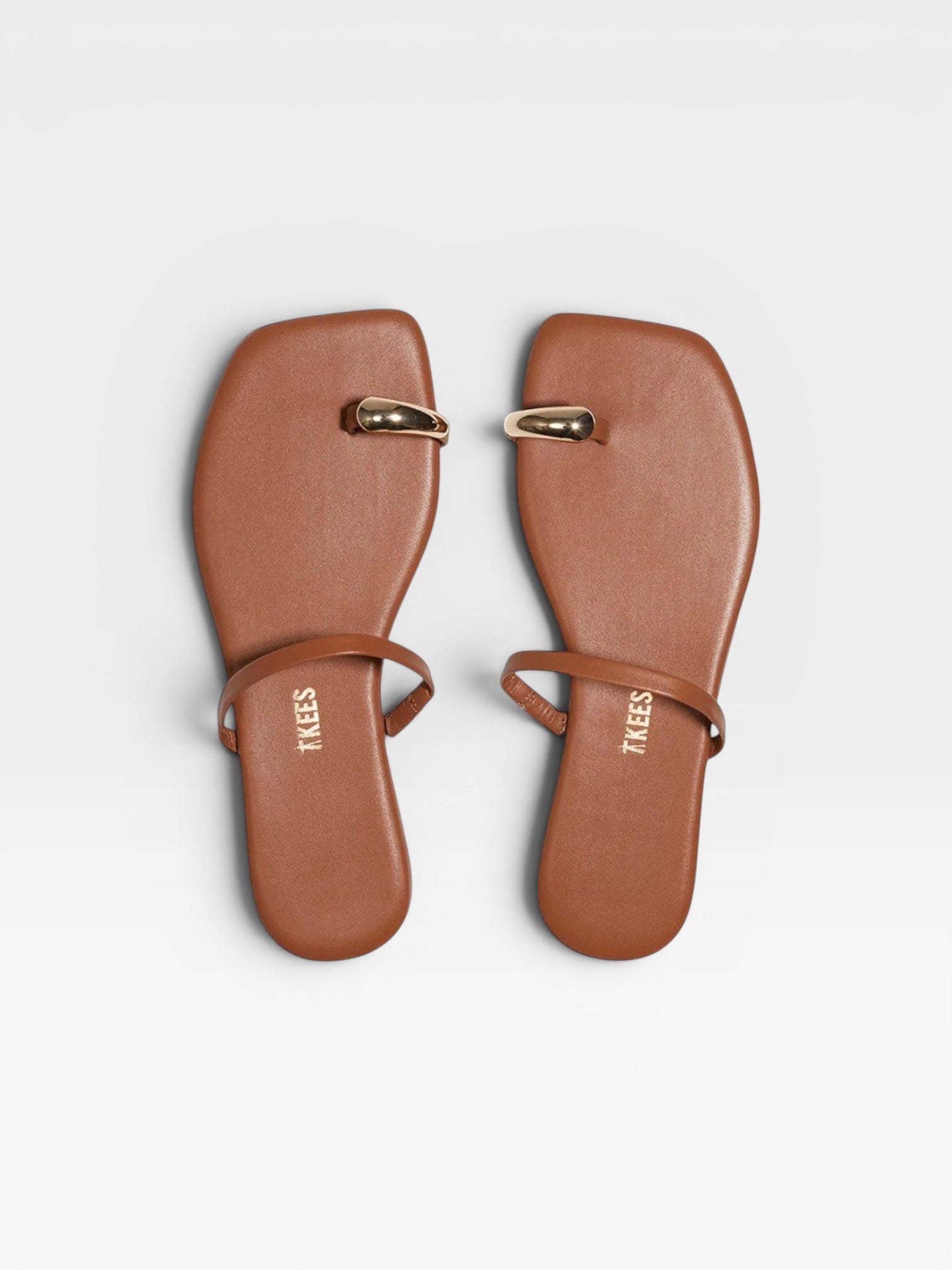 JONES + CO Colette Sandal in Au Naturale brown leather with gold toe ring detail and thin ankle strap.