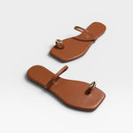 JONES + CO Colette Sandal in Au Naturale brown leather with gold toe ring detail. Minimalist slip-on sandal.