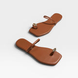 JONES + CO Colette Sandal in Au Naturale brown leather with gold toe ring detail. Minimalist slip-on sandal.