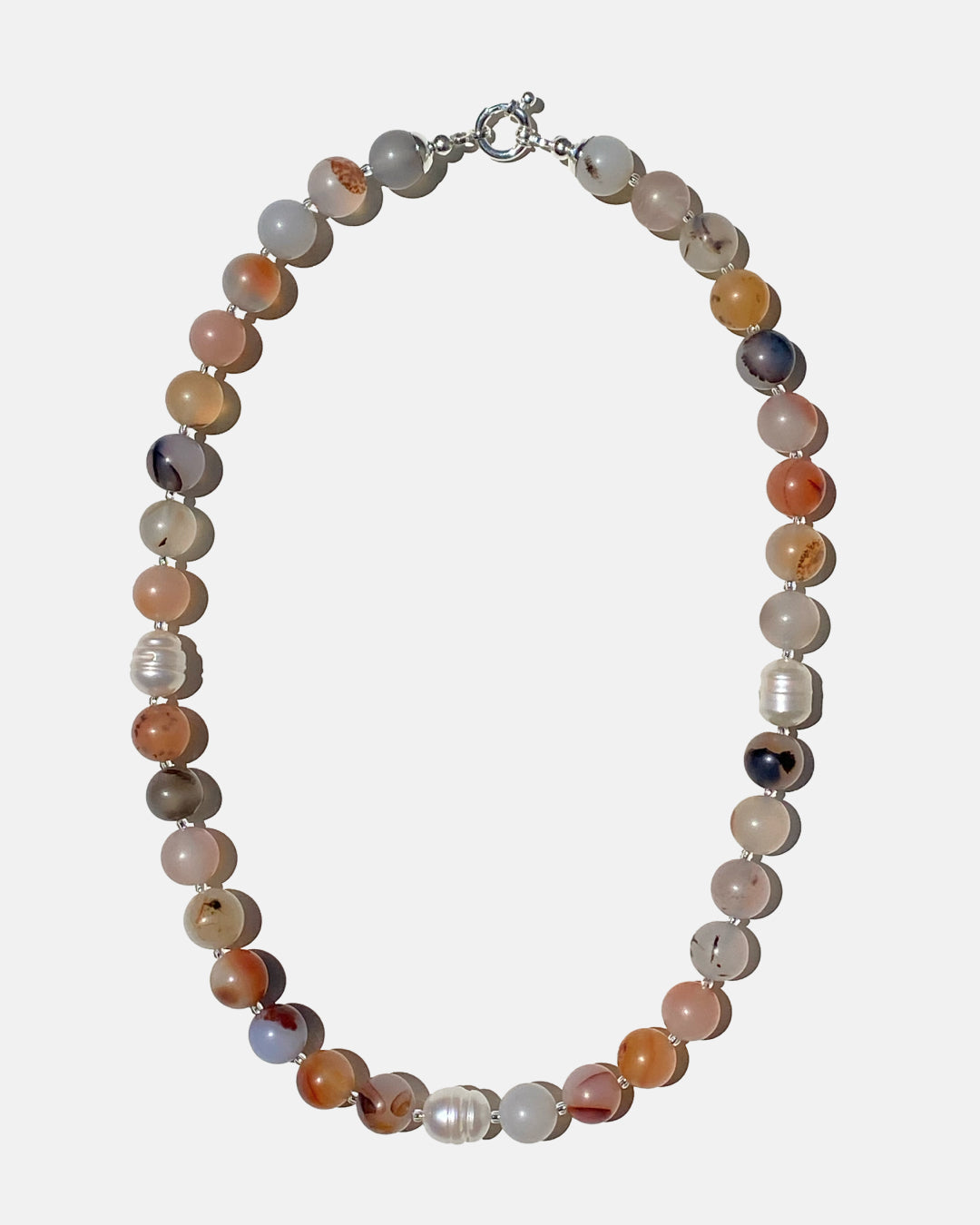 Necklace with multicolored beads on a white background