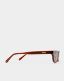 side view of Romi Sunglasses - Transparent Rust