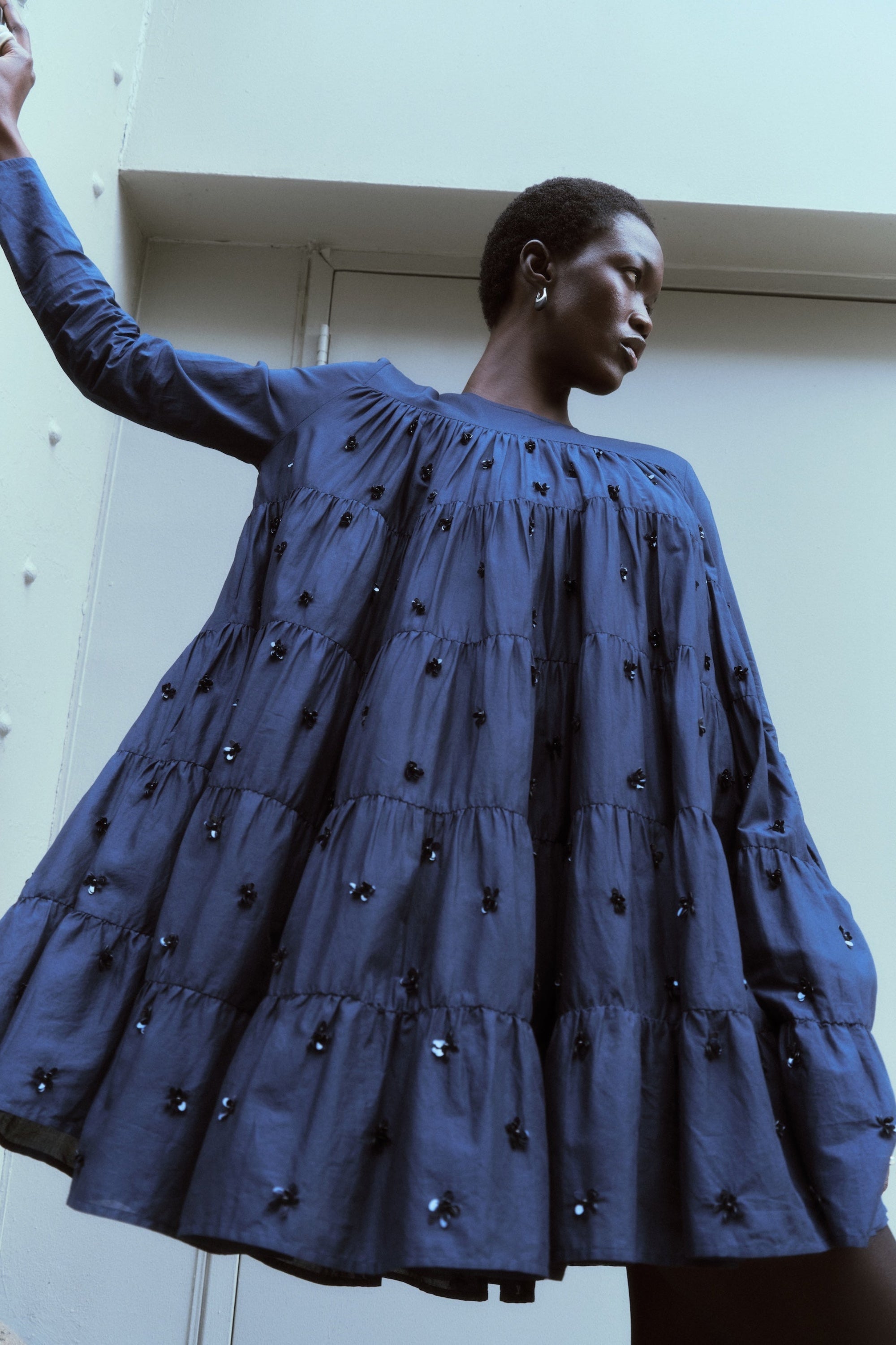 Merlette Soliman Embellished Dress in Navy - campaign image showing the sequin and bead floral embroidery in detail
