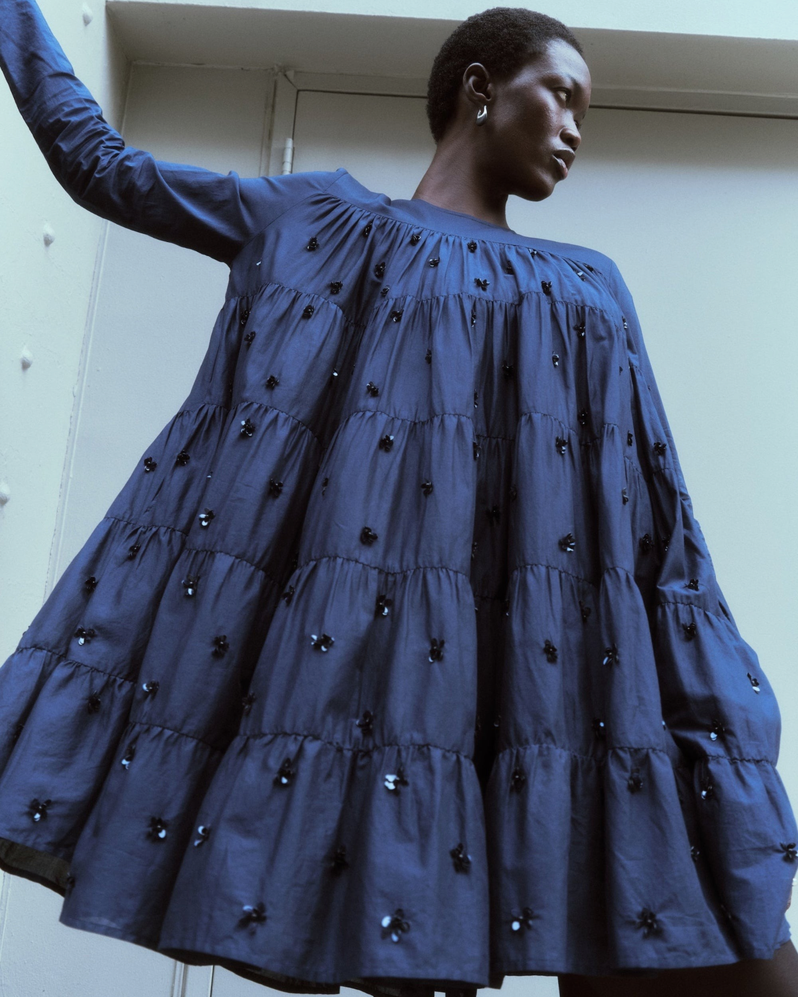 Merlette Soliman Embellished Dress in Navy - campaign image showing the sequin and bead floral embroidery in detail