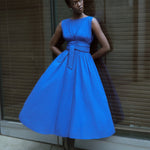 Merlette Verena Dress in Ultramarine — campaign image of the dress worn on location