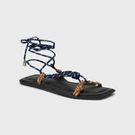 JONES + CO FLÒ SQUARE TWIN sandal featuring blue rope laces and hazelnut braided straps on a black square-toe sole.