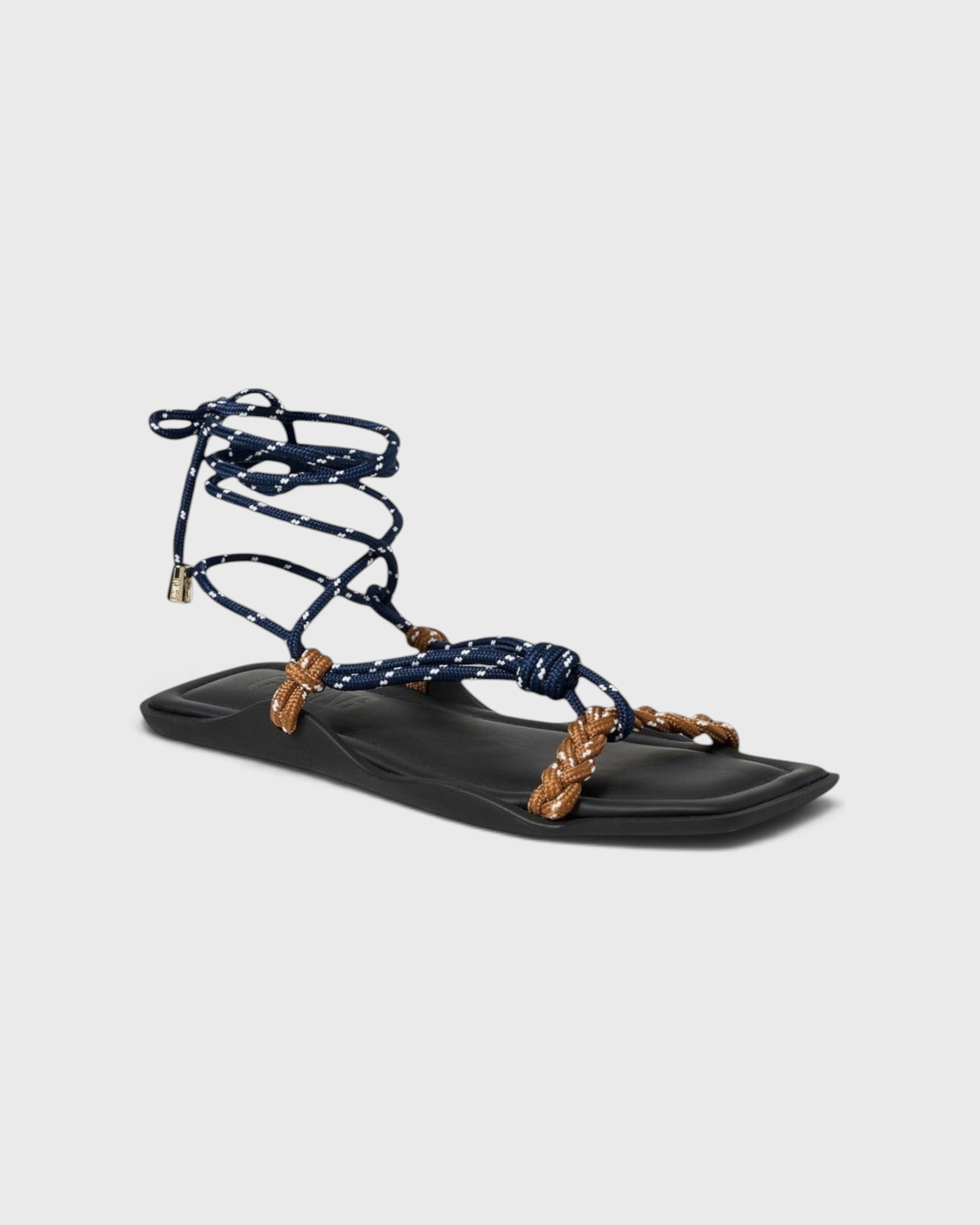 JONES + CO FLÒ SQUARE TWIN sandal featuring blue rope laces and hazelnut braided straps on a black square-toe sole.