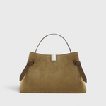 JONES + CO Gyoza pouch in fennel suede with a soft texture, structured handle, and elegant knot side details.