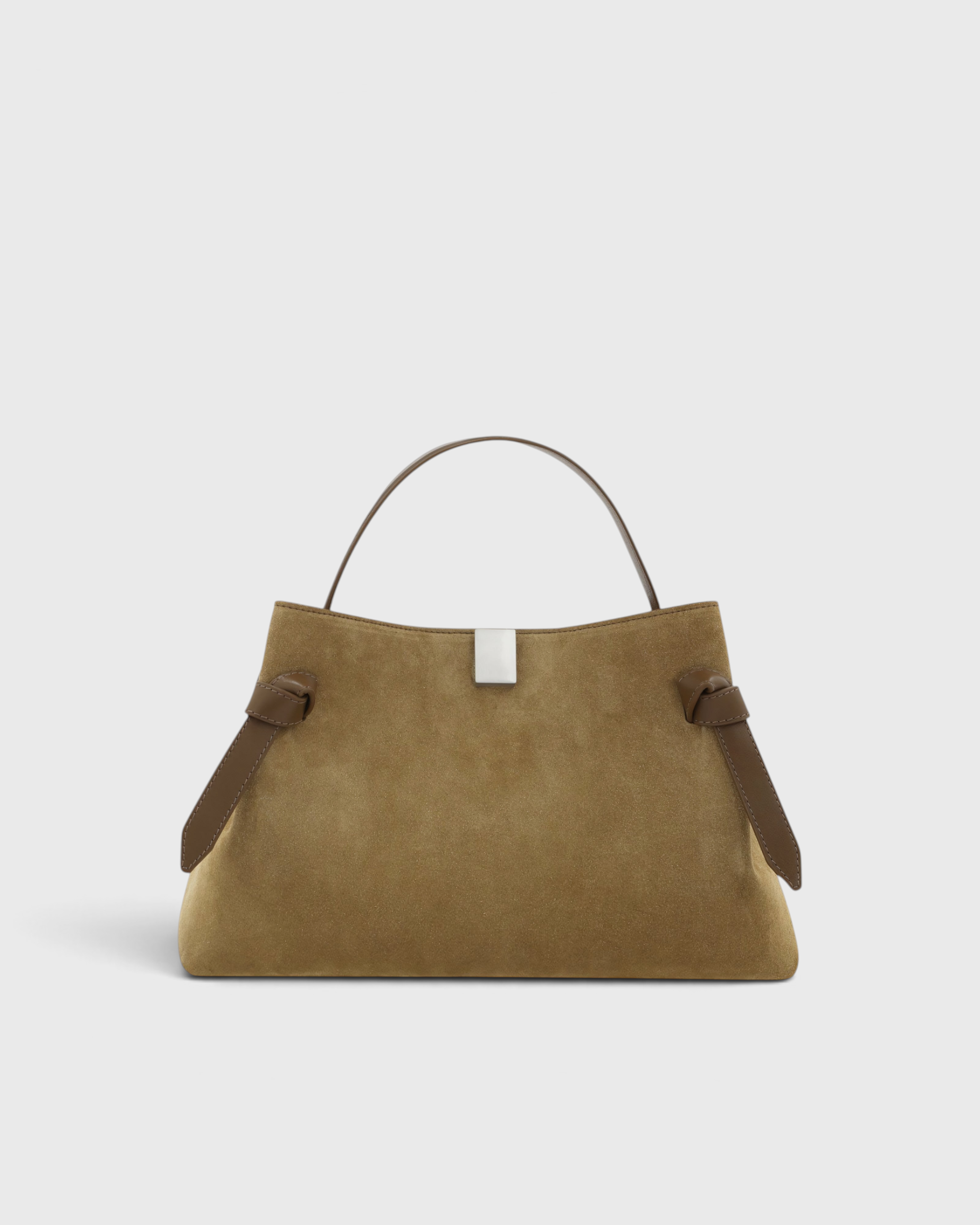 JONES + CO Gyoza pouch in fennel suede with a soft texture, structured handle, and elegant knot side details.