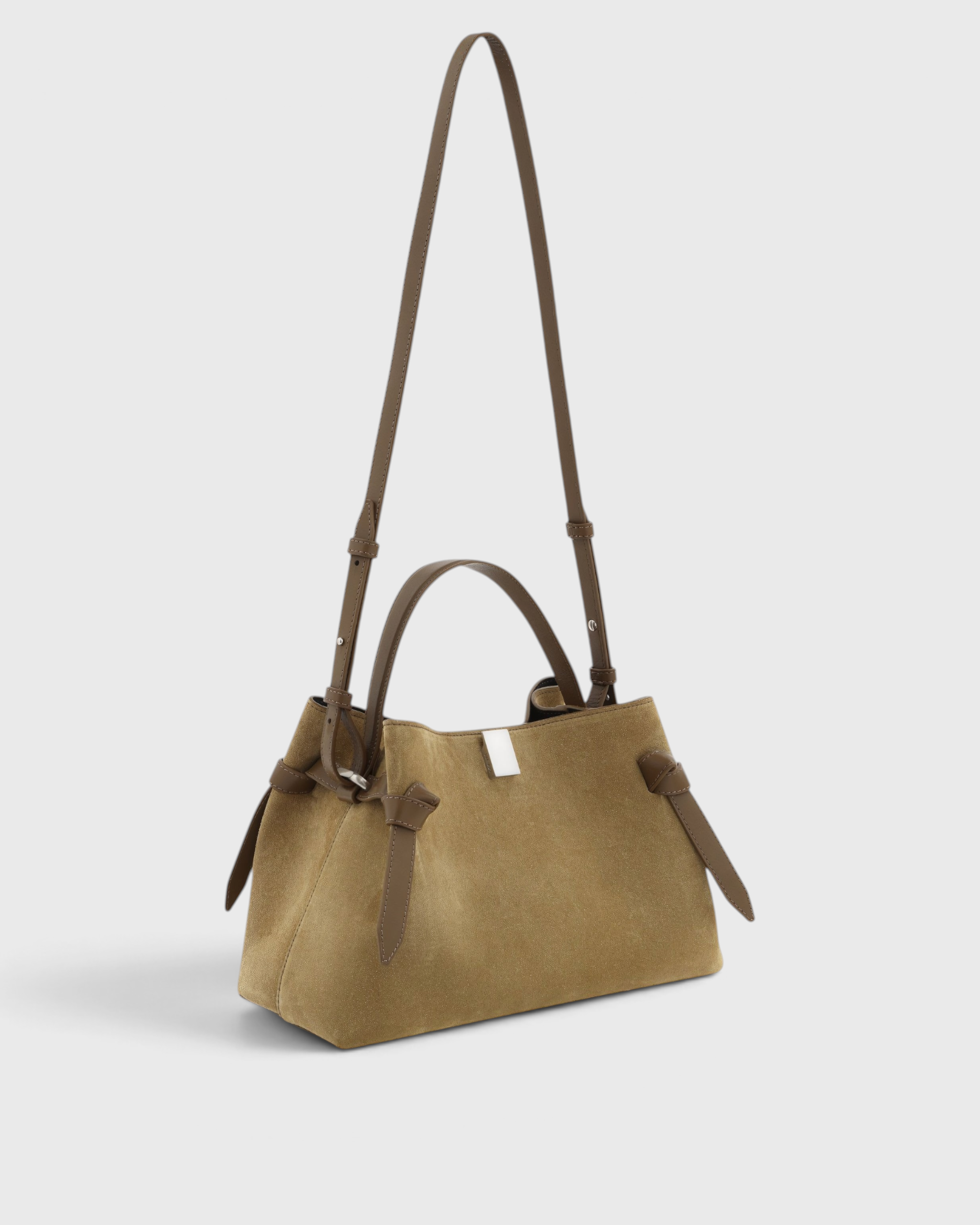 JONES + CO Gyoza pouch in fennel suede with brown leather handles and a compact, elegant design.
