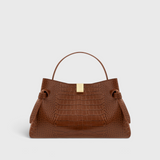 JONES + CO Gyoza pouch in brown embossed leather with a gold clasp and structured handle