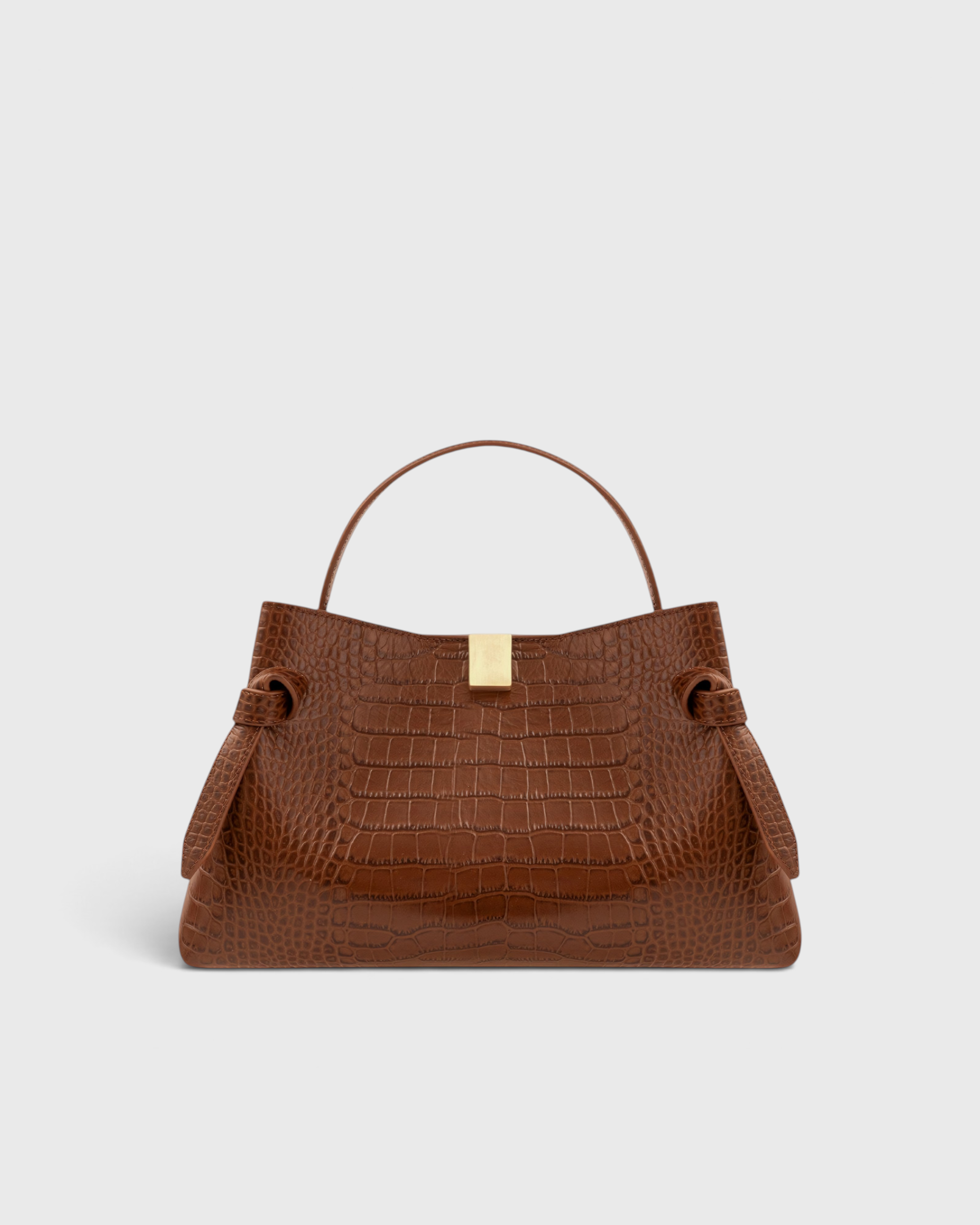 JONES + CO Gyoza pouch in brown embossed leather with a gold clasp and structured handle