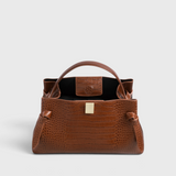 JONES + CO Gyoza pouch in brown Sierra embossed leather with a structured silhouette and gold-tone hardware.
