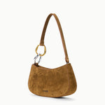 Three-quarter view of the STAUD Ollie Bag in Cigar suede with polished leather trim