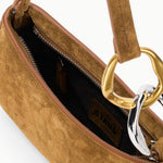 Interior of the STAUD Ollie Bag in Cigar showing the zip pocket and STAUD label