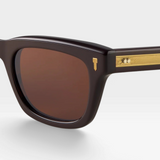 JONES + CO Hopkins cat-eye sunglasses in dark brown acetate with sepia lenses and gold temple hardware.