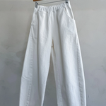 Arc Pants - Milk hanging on hanger