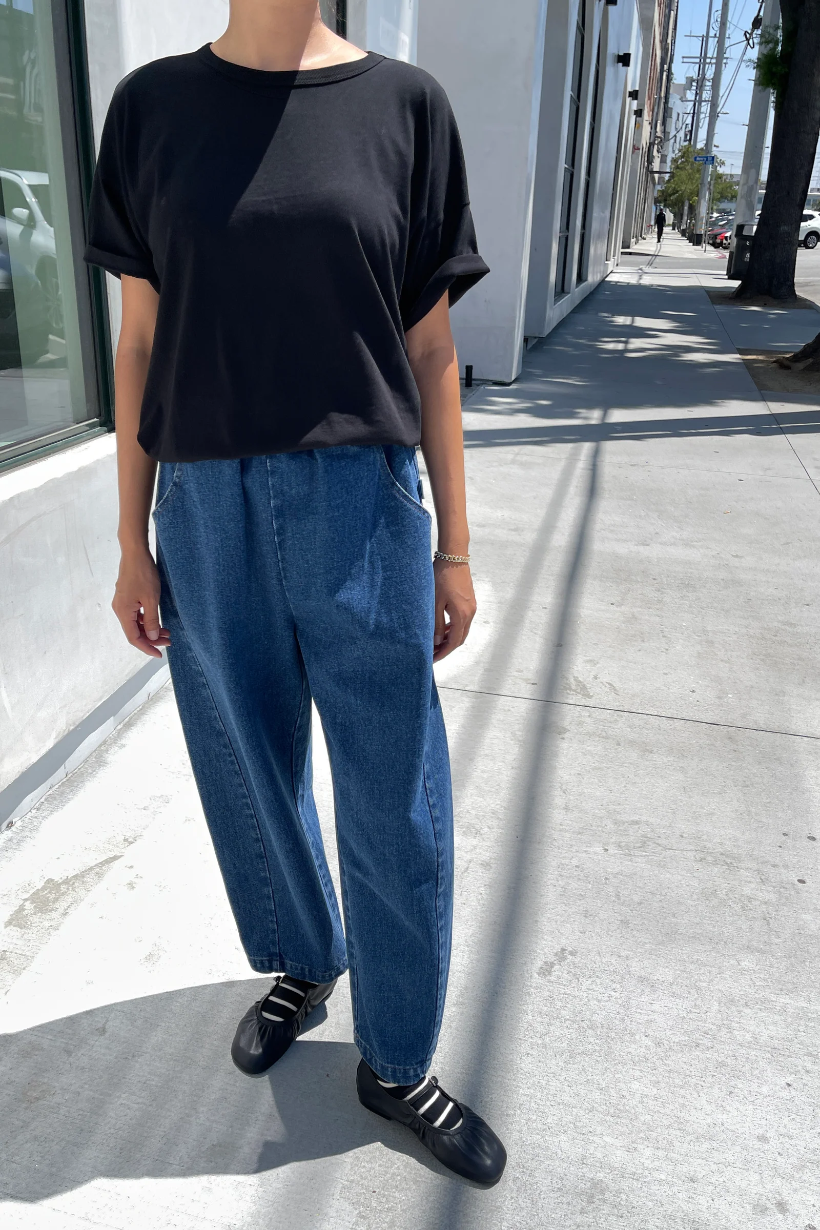 Arc Pants - Blue Denim front view paired with black t-shirt