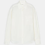 flat lay view of the white button up