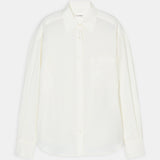 flat lay view of the white button up