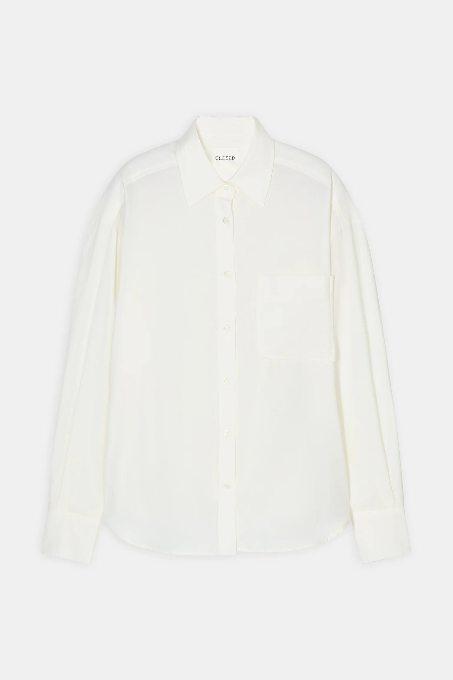 flat lay view of the white button up