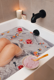 Soothing Bath Salts with rose petals in bath