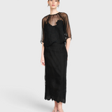 Model wearing JONES + CO black organza Bari top with delicate waterlily embroidery over a matching black slip dress.