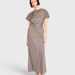 Model wearing JONES + CO Marais silk top and matching skirt in shadowline plaid pattern with draped detail