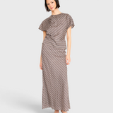 Model wearing JONES + CO Marais silk top and matching skirt in shadowline plaid pattern with draped detail
