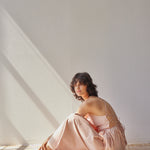 Beth Dress - Pink Stripes on model sitting down 