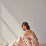 Beth Dress - Pink Stripes on model sitting down 
