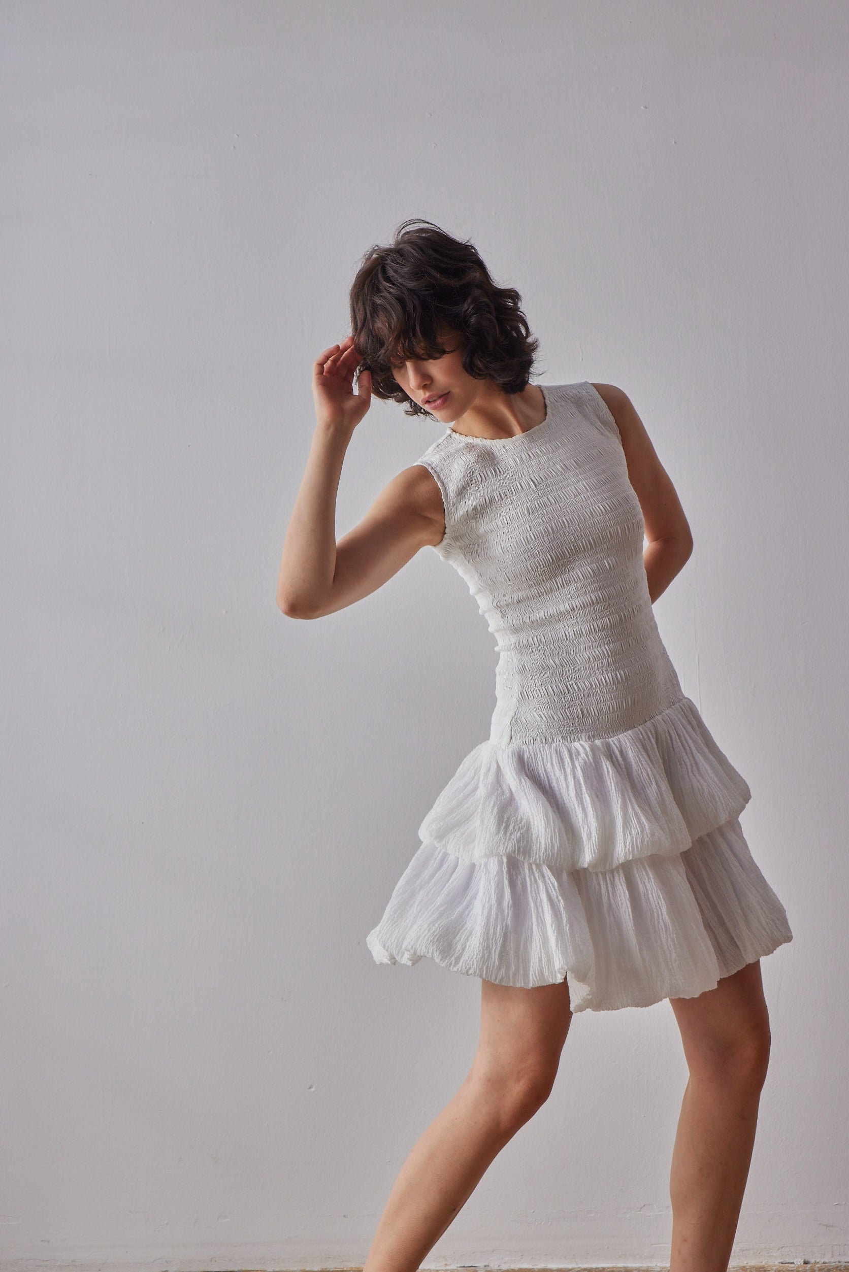 Emilia Dress - White model moving in dress
