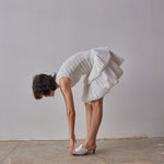 Emilia Dress - White model moving in dress