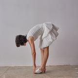 Emilia Dress - White model moving in dress