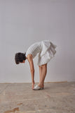 Emilia Dress - White model moving in dress