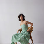 Holly Dress - Green on model in chair