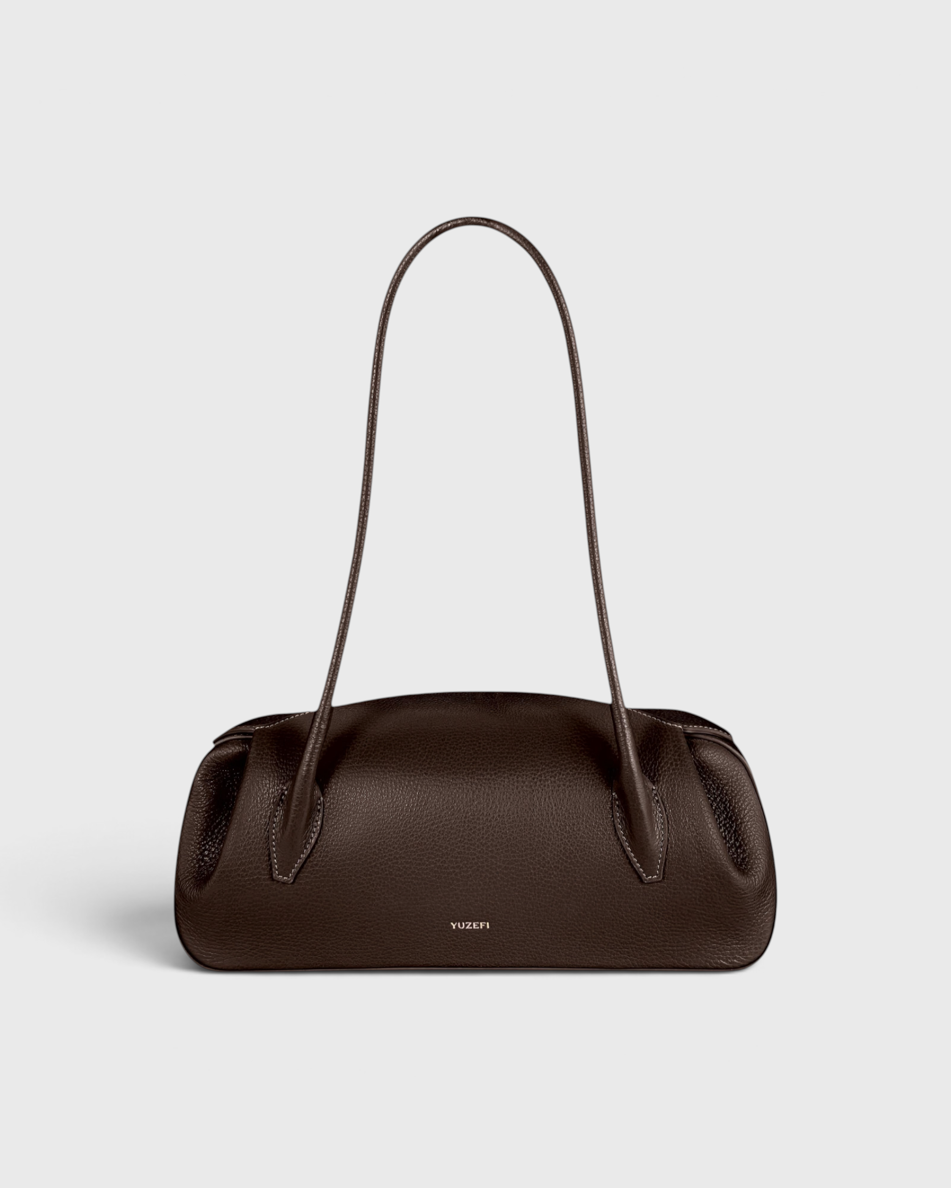 JONES + CO Oyster shoulder bag in espresso pebble grained leather with a sleek, structured design.