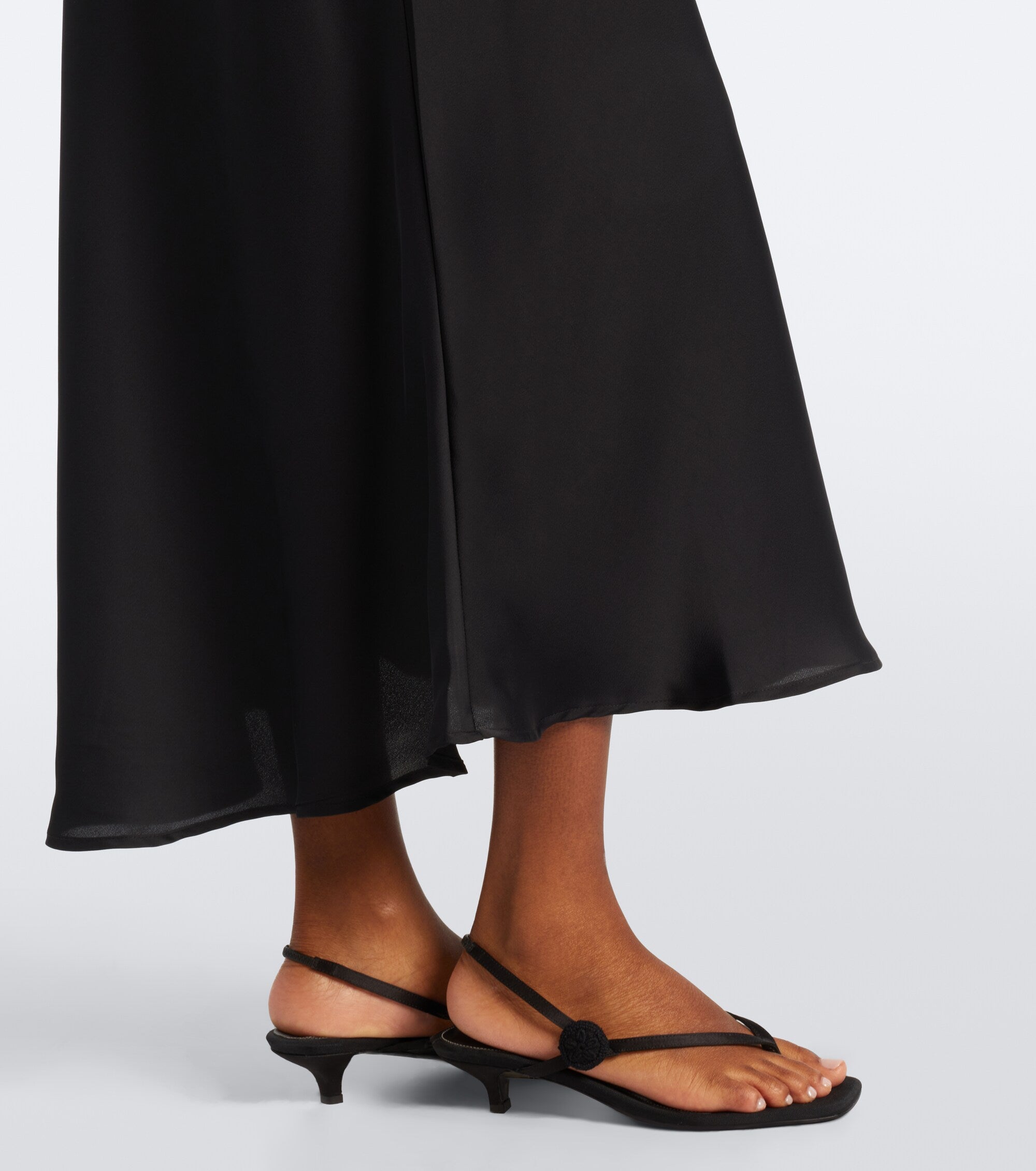 Faithfull the Brand Mina Midi Dress in Black - bias-cut satin hem detail
