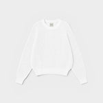 JONES + CO Pia Cotton Sweater in bone white. Features a crew neckline, relaxed sleeves, and cropped silhouette.