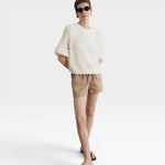 JONES + CO Pia Cotton Sweater in Bone. A textured knit crewneck with relaxed sleeves and a cropped silhouette.