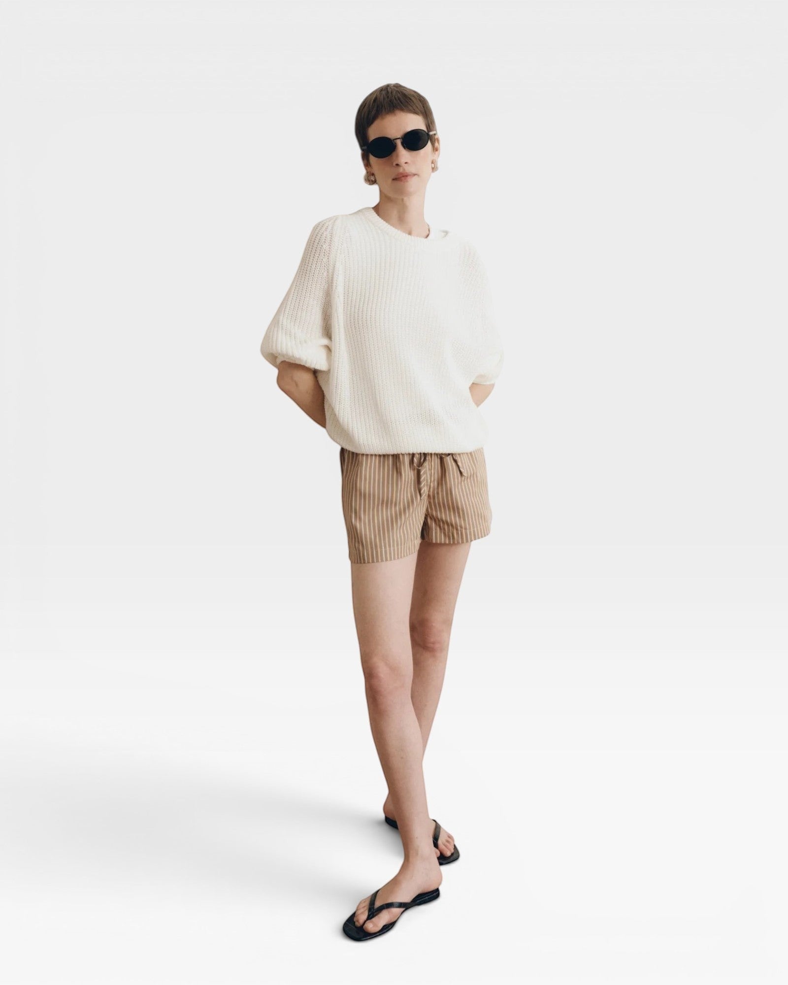 JONES + CO Pia Cotton Sweater in Bone. A textured knit crewneck with relaxed sleeves and a cropped silhouette.