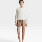 JONES + CO bone white cotton knit crew neck sweater with relaxed sleeves and cropped silhouette.