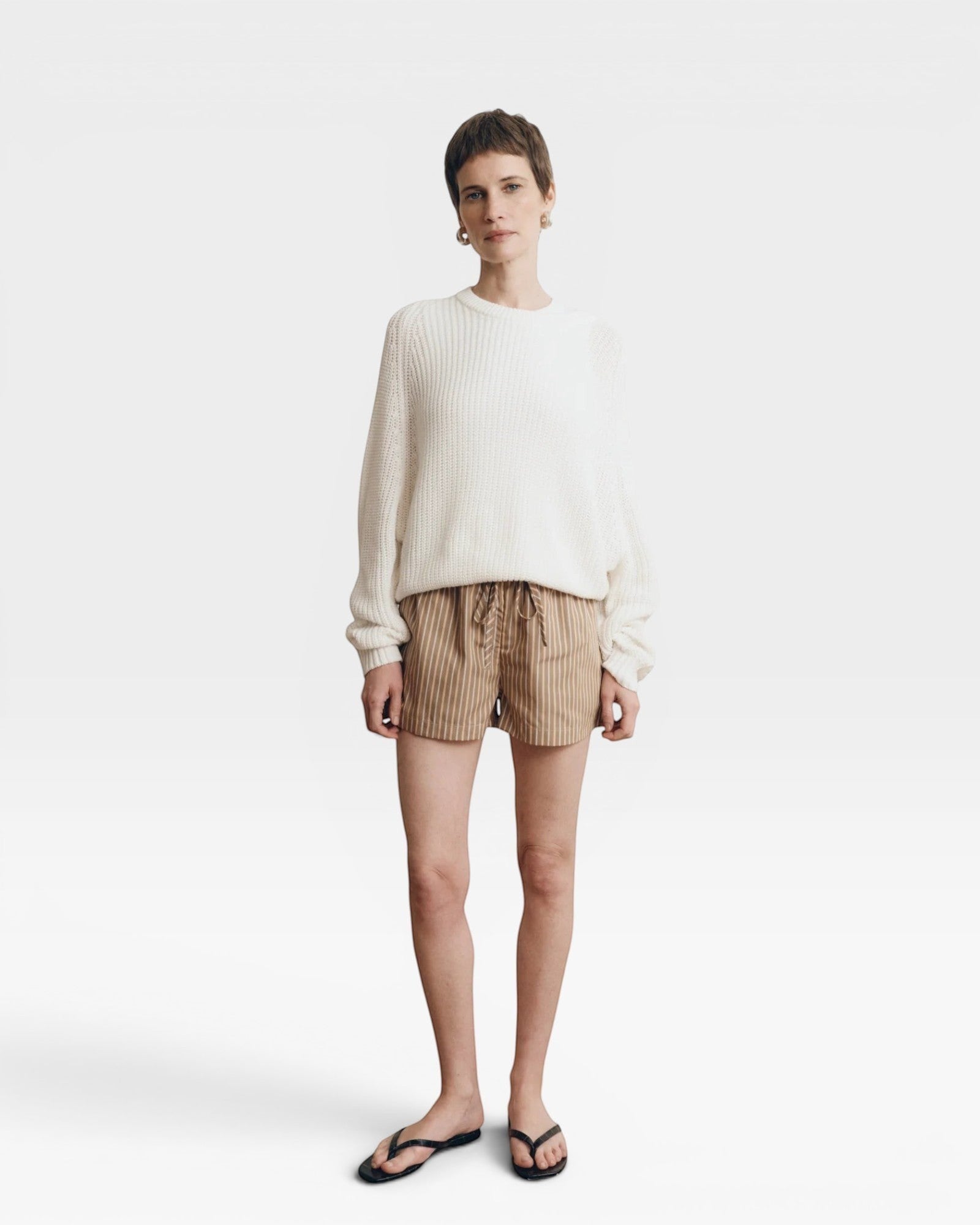JONES + CO bone white cotton knit crew neck sweater with relaxed sleeves and cropped silhouette.