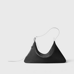 JONES + CO Rider M black leather shoulder bag with a unique skateboard rink shape and adjustable belt-style strap.